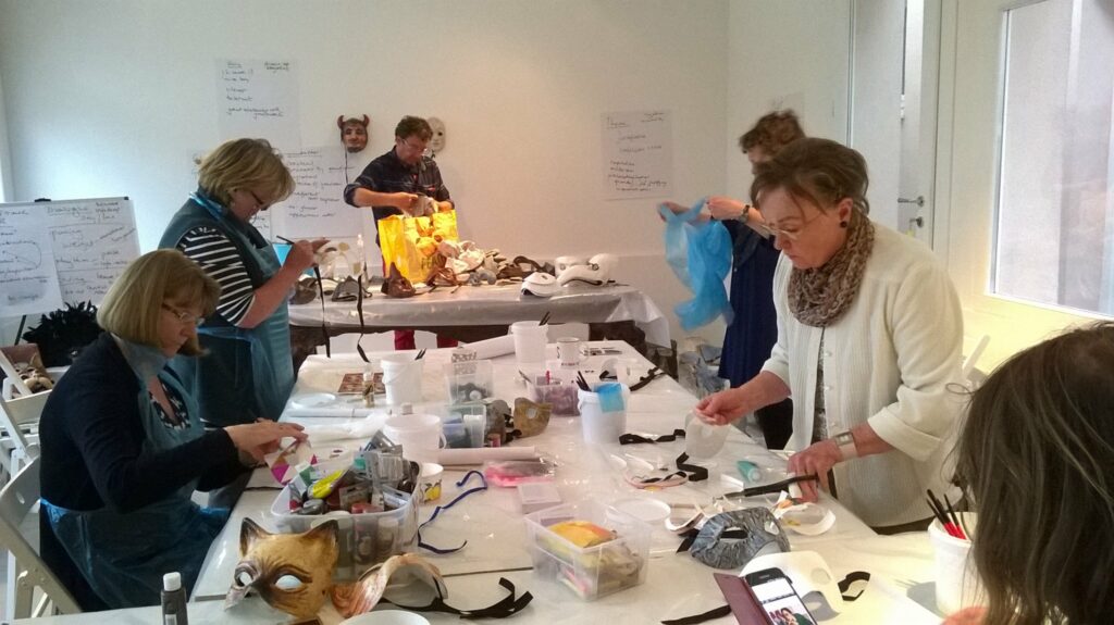 group of ladies painting masks