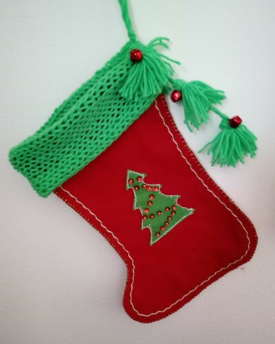 Christmas stockings in felt with applique decorations