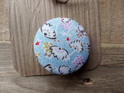 Large textile covered button brooches