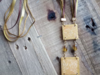 Boho style wood & textile necklace available for purchase